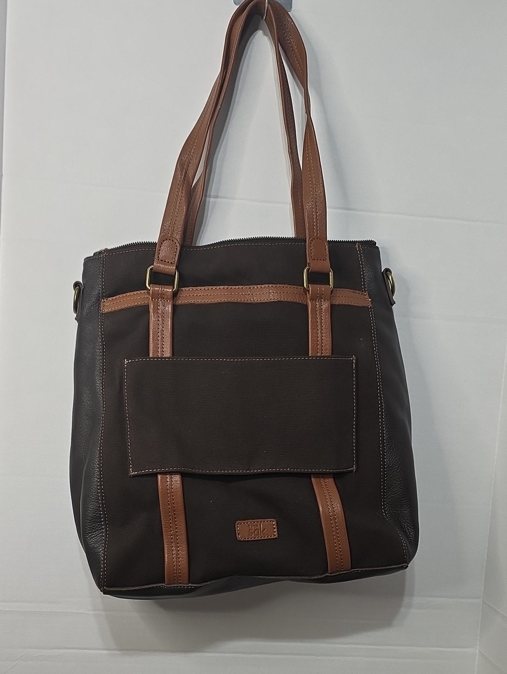 The Sak Brown and Tan Messenger Tote Bag leather and cloth.